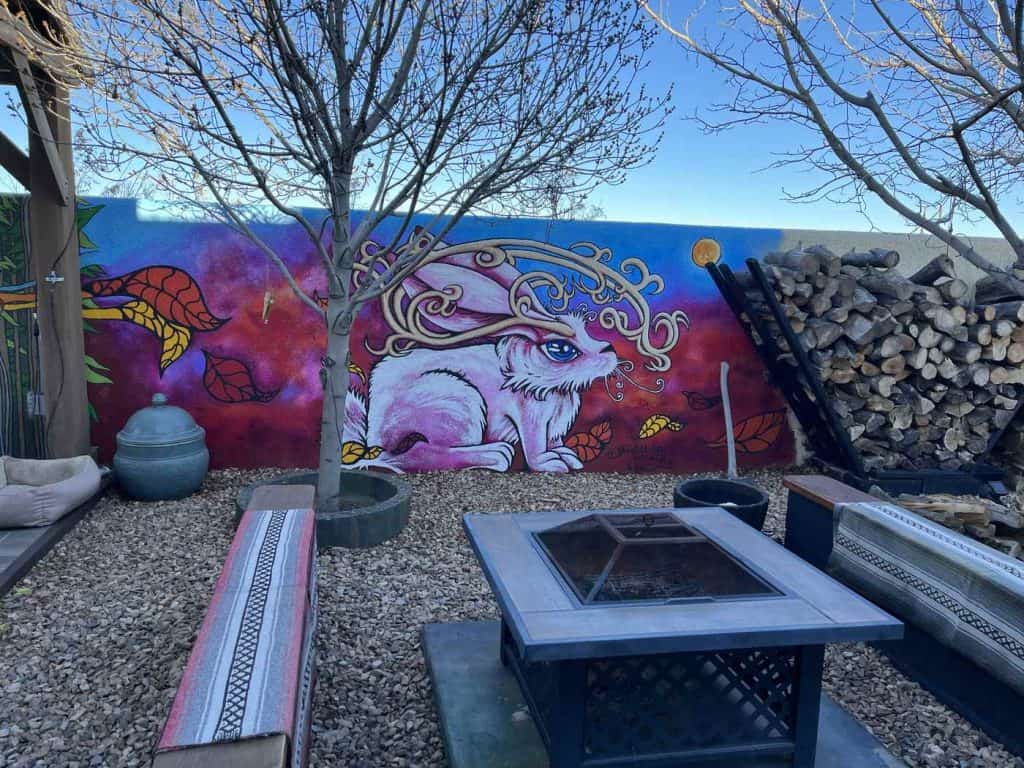 bigfoot wine bar and patio outdoor seating with rabbit mural