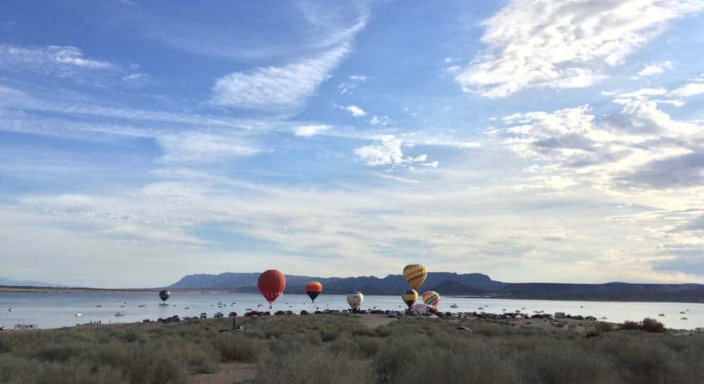 balloons rising over the shores of elephant butte lake