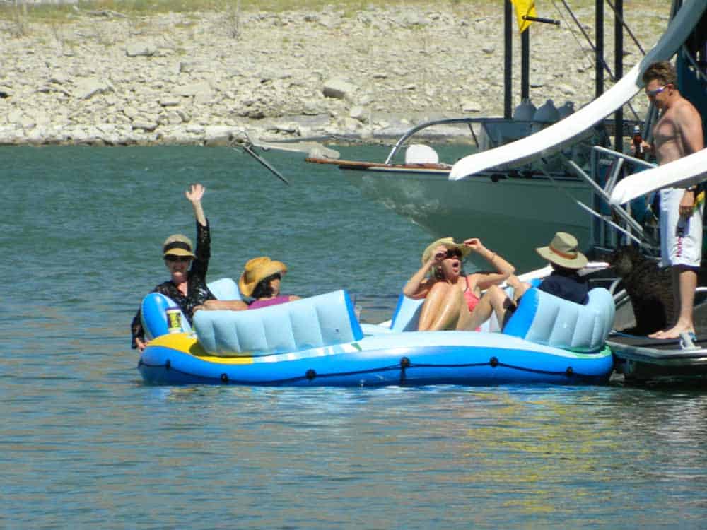 floating on inflatable rafts at the lake