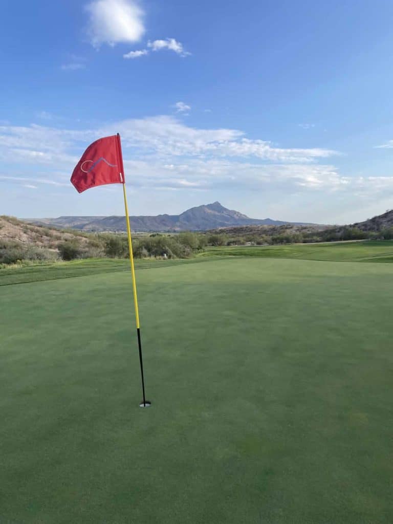 flag on a green at the turtleback mountain golf and resort