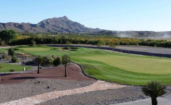 sierra del rio golf course with turtle mountain in the background