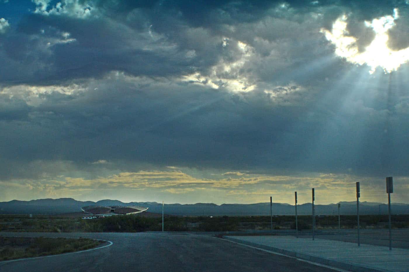 sunlight breaking through clouds entering spaceport america sierra county nm