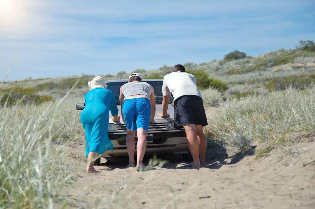 pushing a car thats stuck in sand