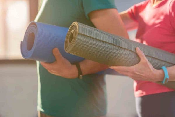 women with yoga mats