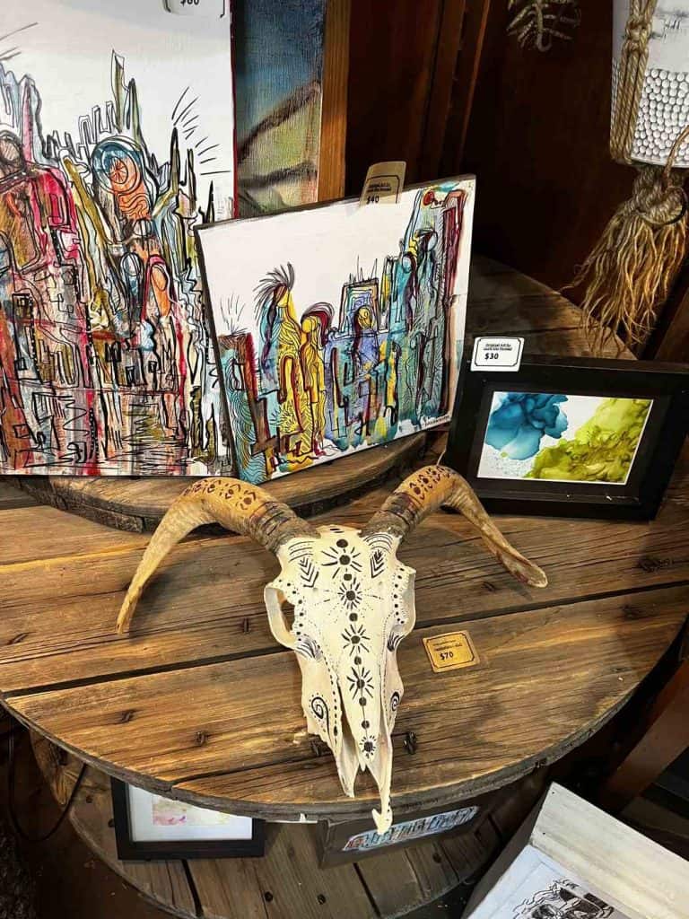 paintings and customized cow skull